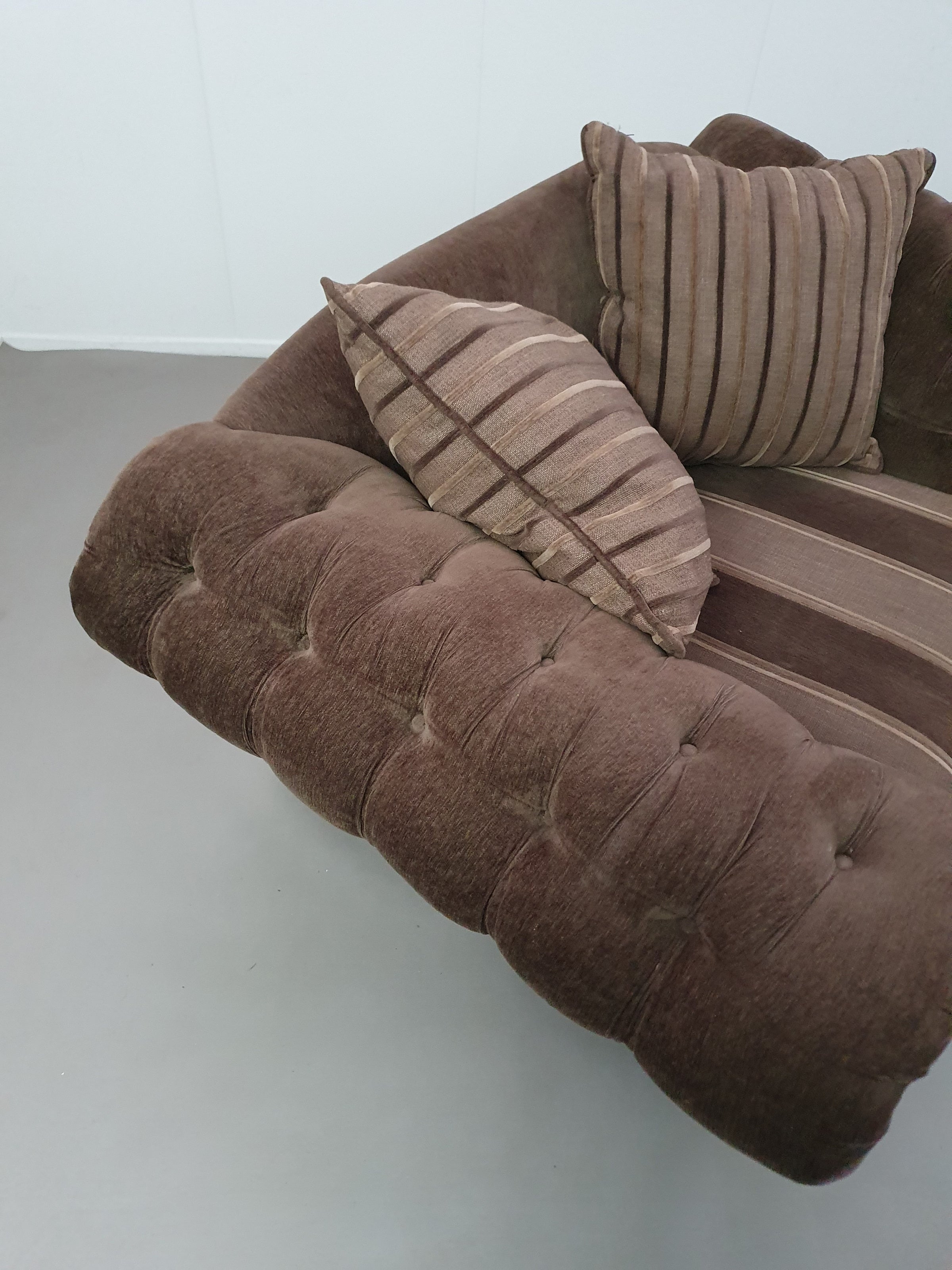 Large weighty love seat with the original matching cushions.
Marked "Handmade in Holland"