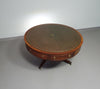 Mahogany Victorian " Heldense " Coffee table / Drum table with leather top on brass wheels. '80s