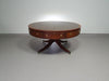 Mahogany Victorian " Heldense " Coffee table / Drum table with leather top on brass wheels. '80s