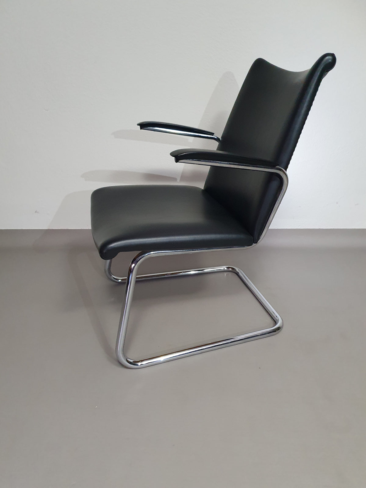 Vintage Dutch Design arm chair De Wit Model 4014 with vinyl upholstery. 