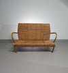 Vintage French papercord sofa with a metal frame base