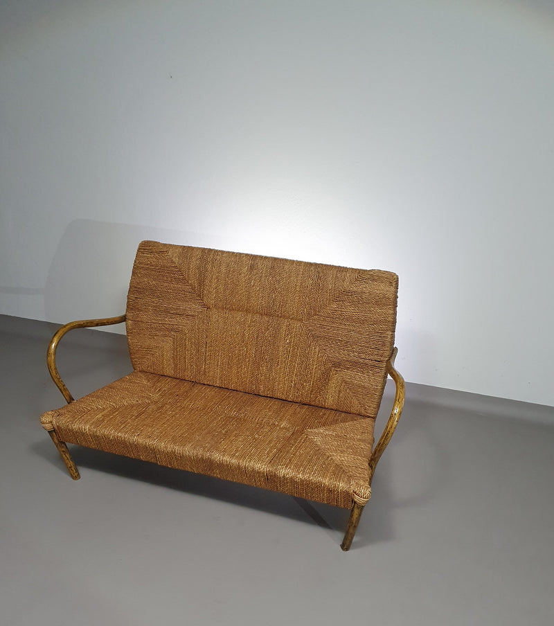 Vintage French papercord sofa with a metal frame base