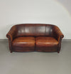 Beautiful subtly designed sheep leather club chair / sofa from the Joris brand.