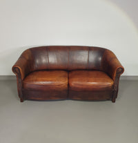 Beautiful subtly designed sheep leather club chair / sofa from the Joris brand.