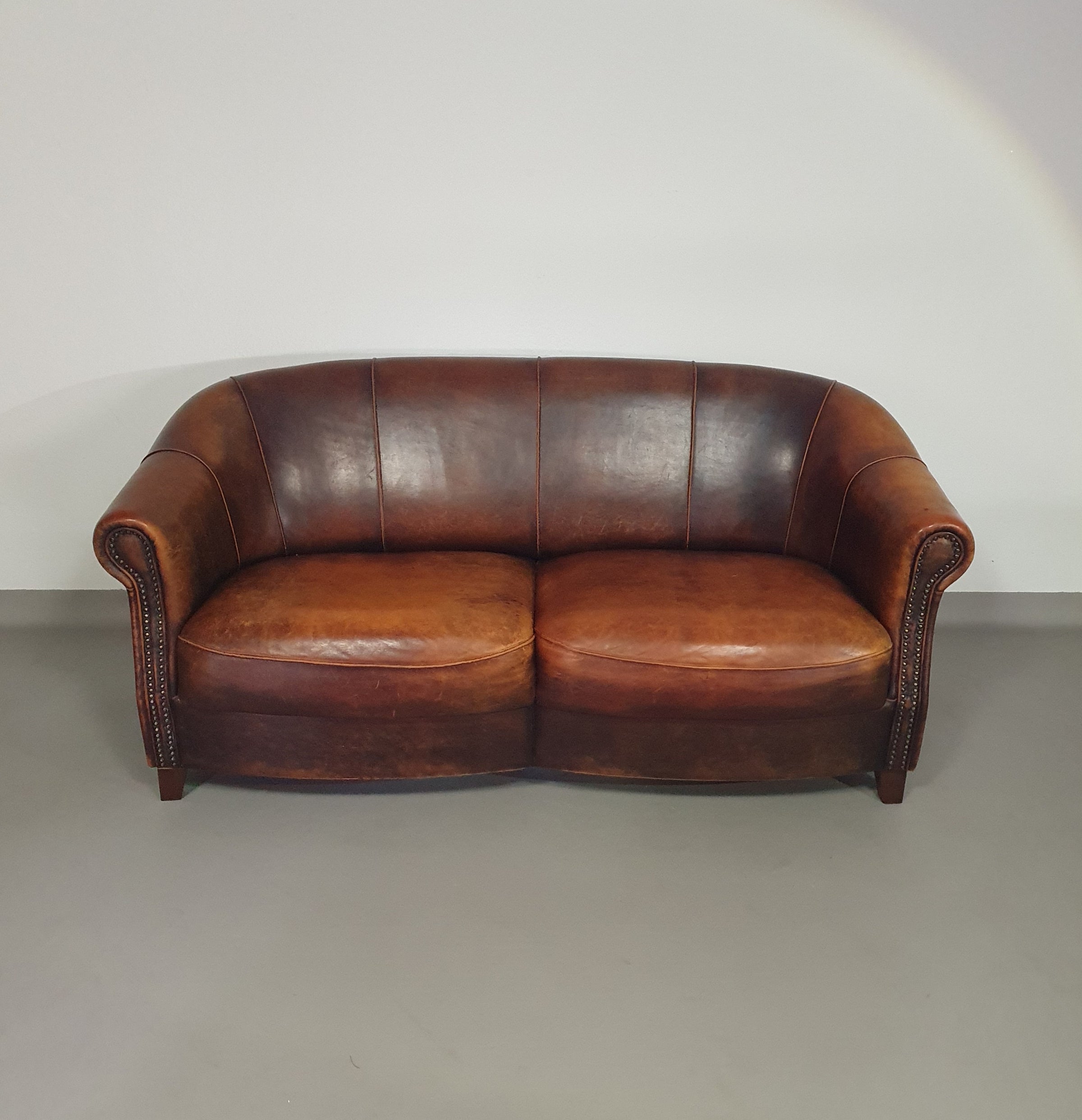 Beautiful subtly designed sheep leather club chair / sofa from the Joris brand.