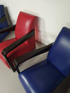 4 x Vintage Ying lounge chairs / fauteuils van Hugues Chevalier, jaren 1990. 3 x blue / 1 x red leather. Special made in these colours for Tommy Hilfiger. With traces of use.