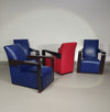 4 x Vintage Ying lounge chairs / fauteuils van Hugues Chevalier, jaren 1990. 3 x blue / 1 x red leather. Special made in these colours for Tommy Hilfiger. With traces of use.