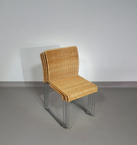 Stacking wicker, rattan chairs (4) model S.21 on a chromed steel structure. Designed by Tito Agnoli