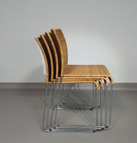 Stacking wicker, rattan chairs (4) model S.21 on a chromed steel structure. Designed by Tito Agnoli