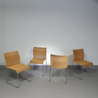 Stacking wicker, rattan chairs (4) model S.21 on a chromed steel structure. Designed by Tito Agnoli