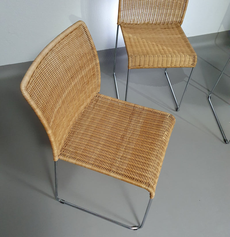 Stacking wicker, rattan chairs (4) model S.21 on a chromed steel structure. Designed by Tito Agnoli