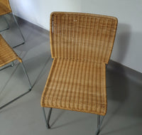 Stacking wicker, rattan chairs (4) model S.21 on a chromed steel structure. Designed by Tito Agnoli