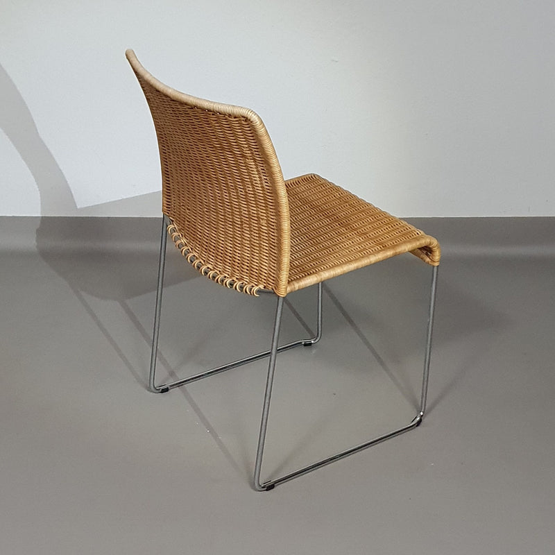 Stacking wicker, rattan chairs (4) model S.21 on a chromed steel structure. Designed by Tito Agnoli