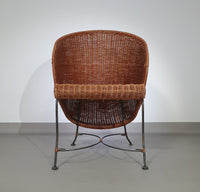 Small side table / chair with elegantly curved wrought iron legs enhanced by a woven rattan seat and top