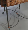 Small side table / chair with elegantly curved wrought iron legs enhanced by a woven rattan seat and top