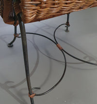 Small side table / chair with elegantly curved wrought iron legs enhanced by a woven rattan seat and top