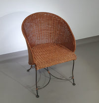 Small side table / chair with elegantly curved wrought iron legs enhanced by a woven rattan seat and top