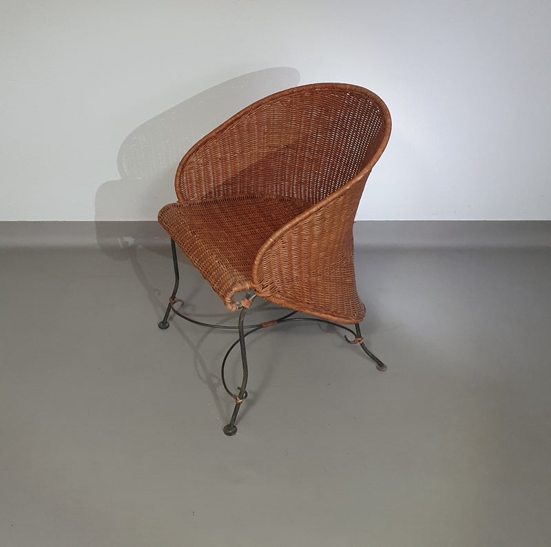 Small side table / chair with elegantly curved wrought iron legs enhanced by a woven rattan seat and top