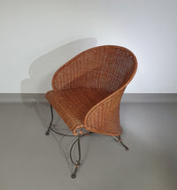 Small side table / chair with elegantly curved wrought iron legs enhanced by a woven rattan seat and top