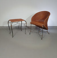 Small side table / chair with elegantly curved wrought iron legs enhanced by a woven rattan seat and top