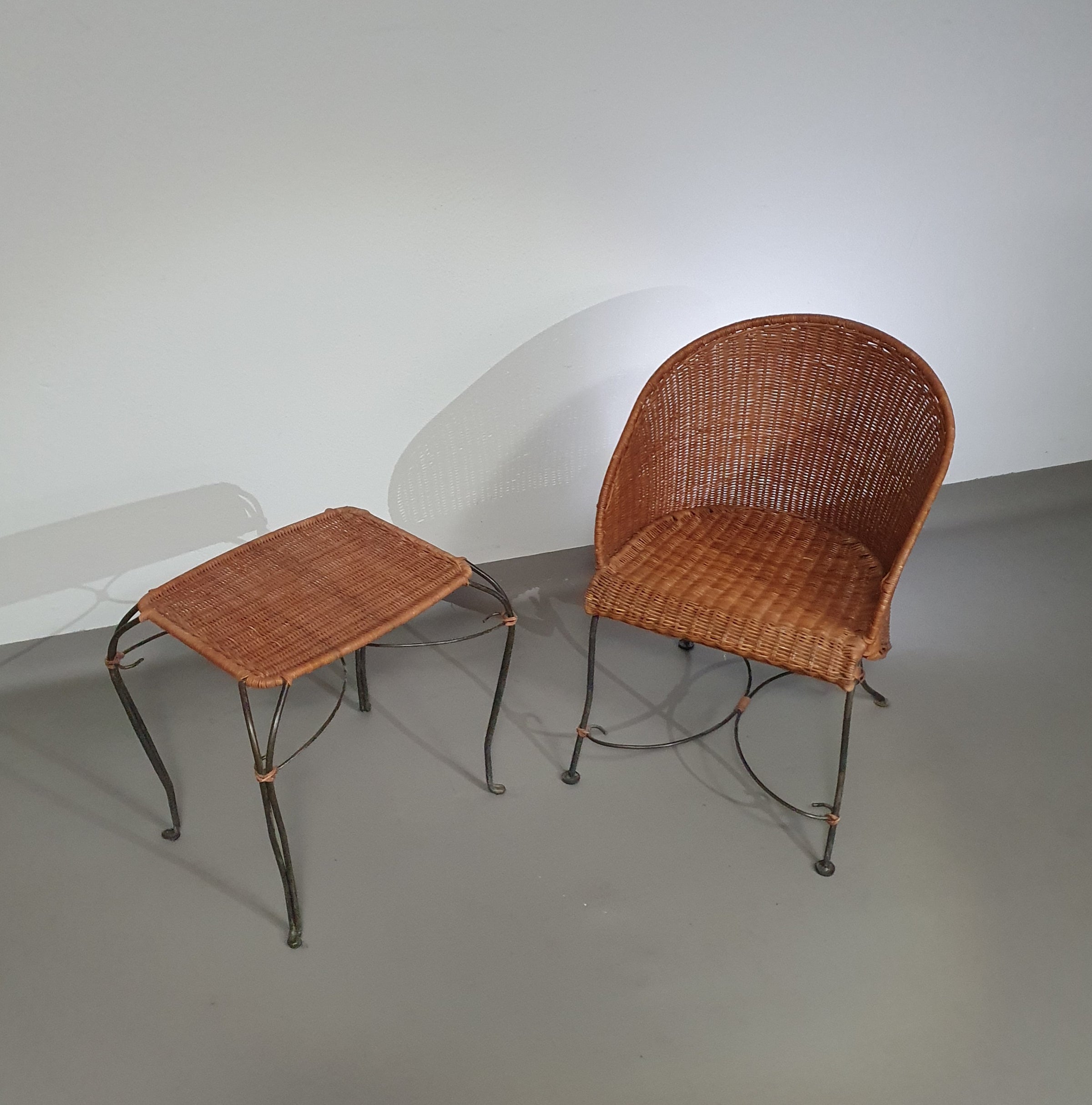 Small side table / chair with elegantly curved wrought iron legs enhanced by a woven rattan seat and top