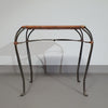 Small side table / chair with elegantly curved wrought iron legs enhanced by a woven rattan seat and top