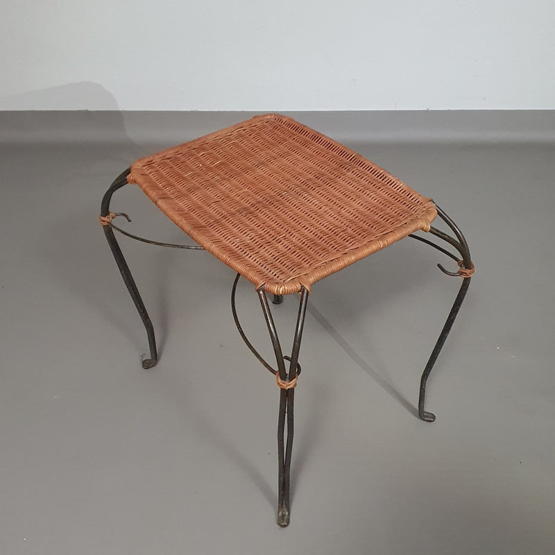 Small side table / chair with elegantly curved wrought iron legs enhanced by a woven rattan seat and top