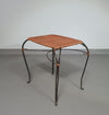 Small side table / chair with elegantly curved wrought iron legs enhanced by a woven rattan seat and top