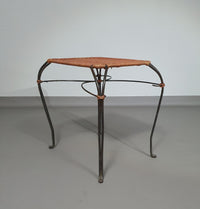 Small side table / chair with elegantly curved wrought iron legs enhanced by a woven rattan seat and top