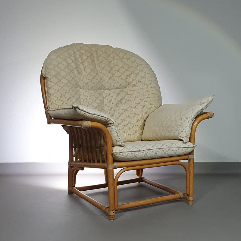 Oversized rattan / bamboo lounge chair with original cushions. 1970s