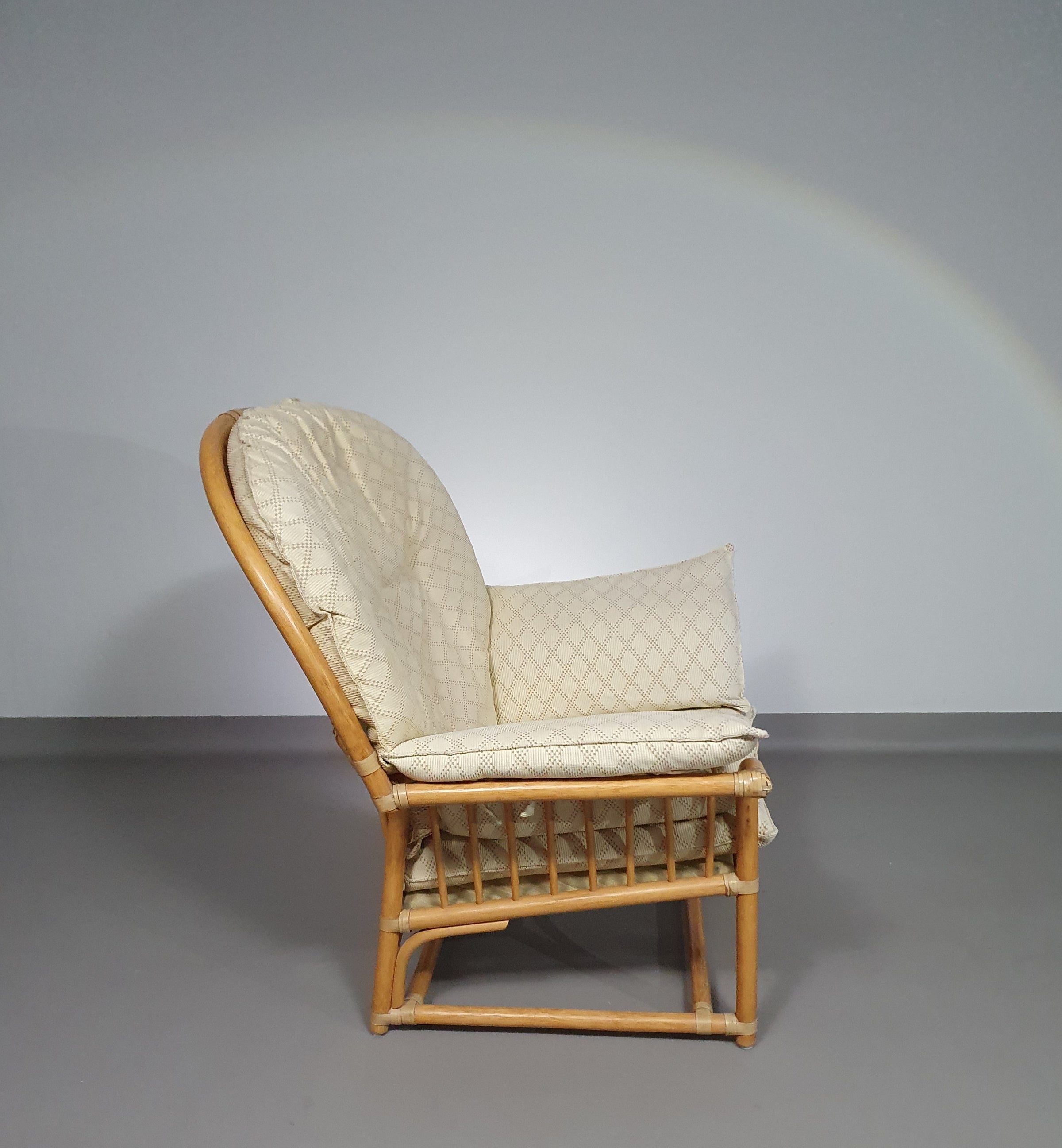 Oversized rattan / bamboo lounge chair with original cushions. 1970s