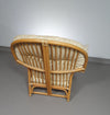 Oversized rattan / bamboo lounge chair with original cushions. 1970s