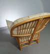 Oversized rattan / bamboo lounge chair with original cushions. 1970s