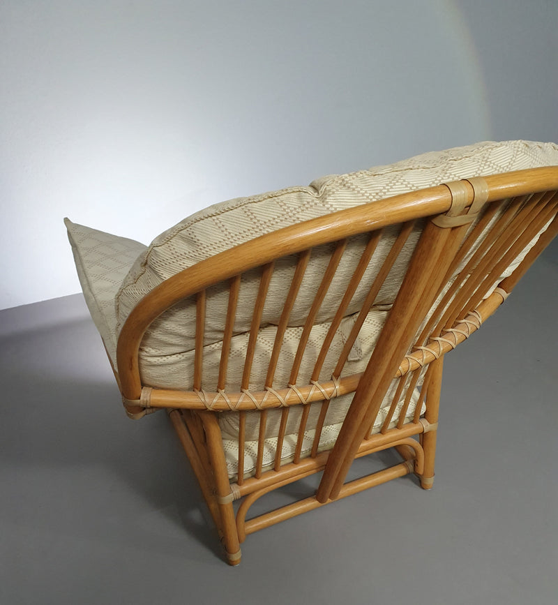 Oversized rattan / bamboo lounge chair with original cushions. 1970s