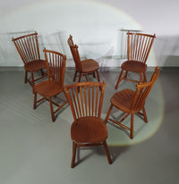 De Ster Geldermalsen Spindle Back dining chair 6 x in solid Oak. With a small carved decoration in the back rest.
1960s