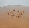 Rare coffee table 110 x 110 x height 35 cm
with 8 flange wooden / cork caps in the glass top.