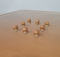 Rare coffee table 110 x 110 x height 35 cm
with 8 flange wooden / cork caps in the glass top.