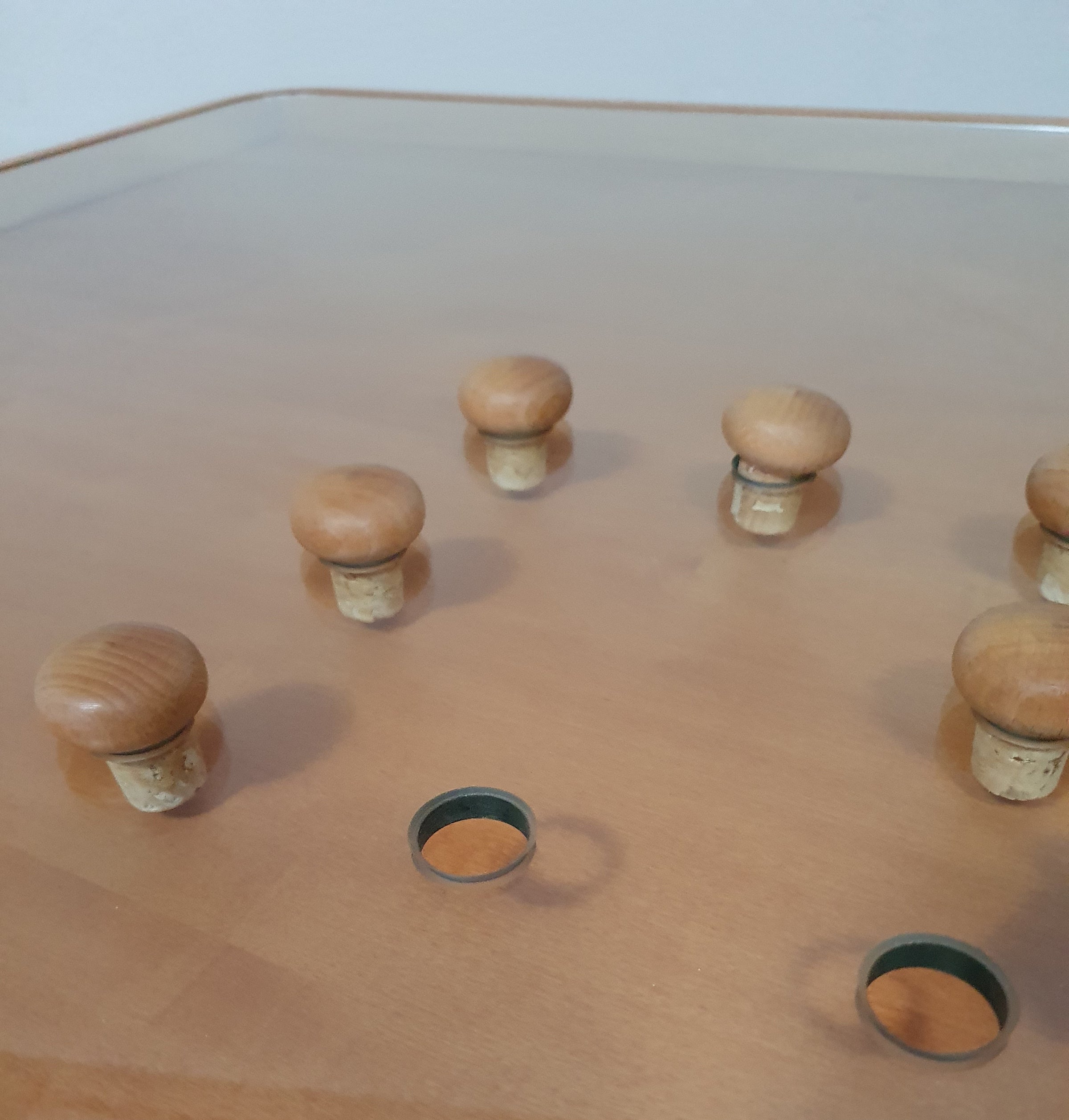 Rare coffee table 110 x 110 x height 35 cm
with 8 flange wooden / cork caps in the glass top.