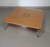 Rare coffee table 110 x 110 x height 35 cm
with 8 flange wooden / cork caps in the glass top.