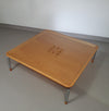 Rare coffee table 110 x 110 x height 35 cm
with 8 flange wooden / cork caps in the glass top.