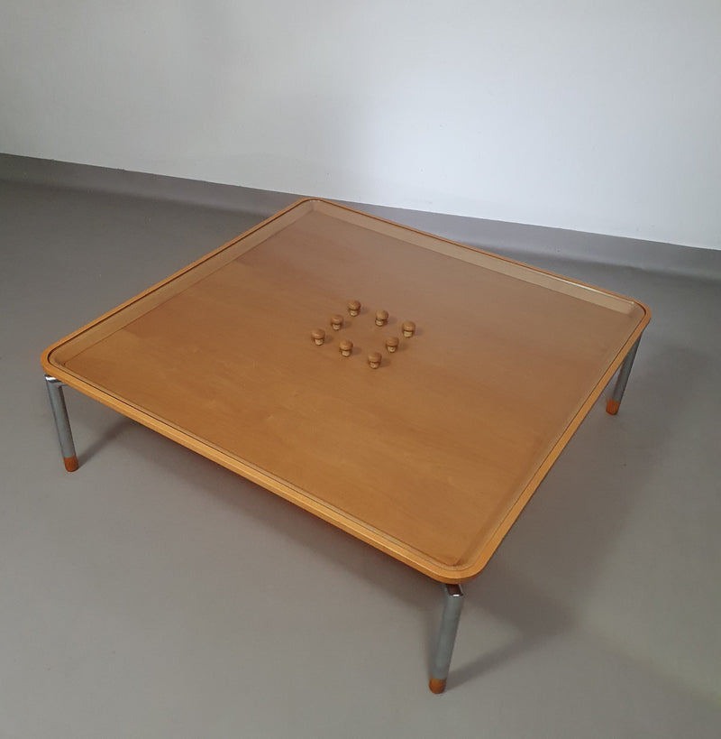 Rare coffee table 110 x 110 x height 35 cm
with 8 flange wooden / cork caps in the glass top.