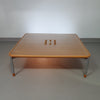 Rare coffee table 110 x 110 x height 35 cm
with 8 flange wooden / cork caps in the glass top.