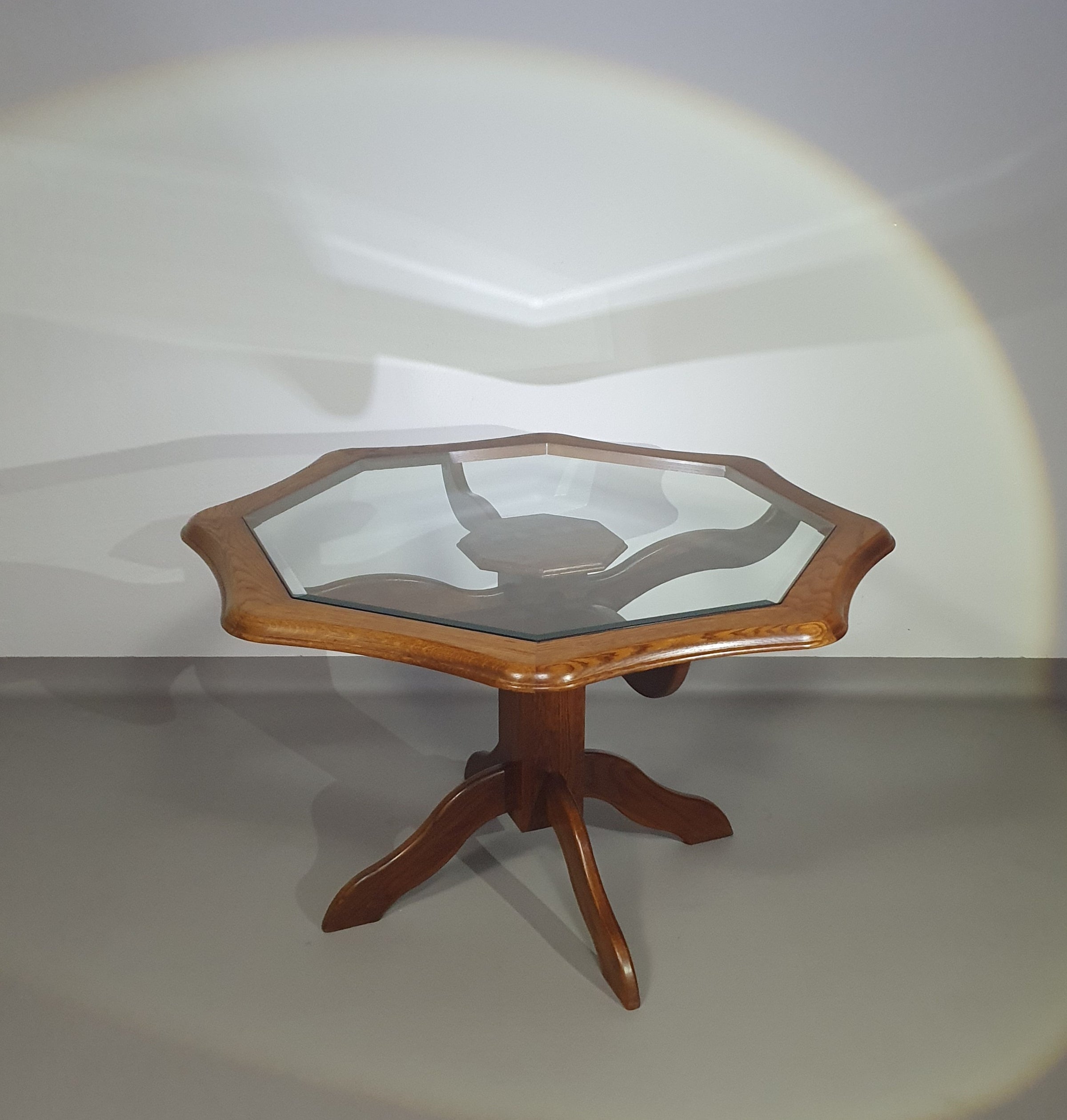 Octagonal oak dining table with inlaid glass top