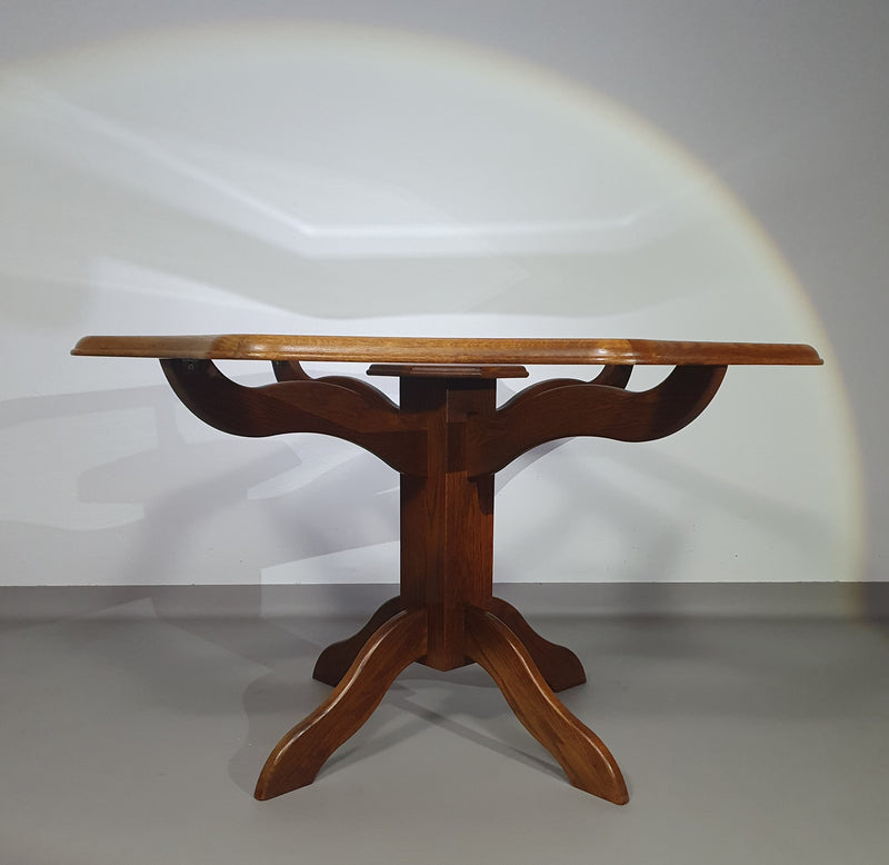 Octagonal oak dining table with inlaid glass top