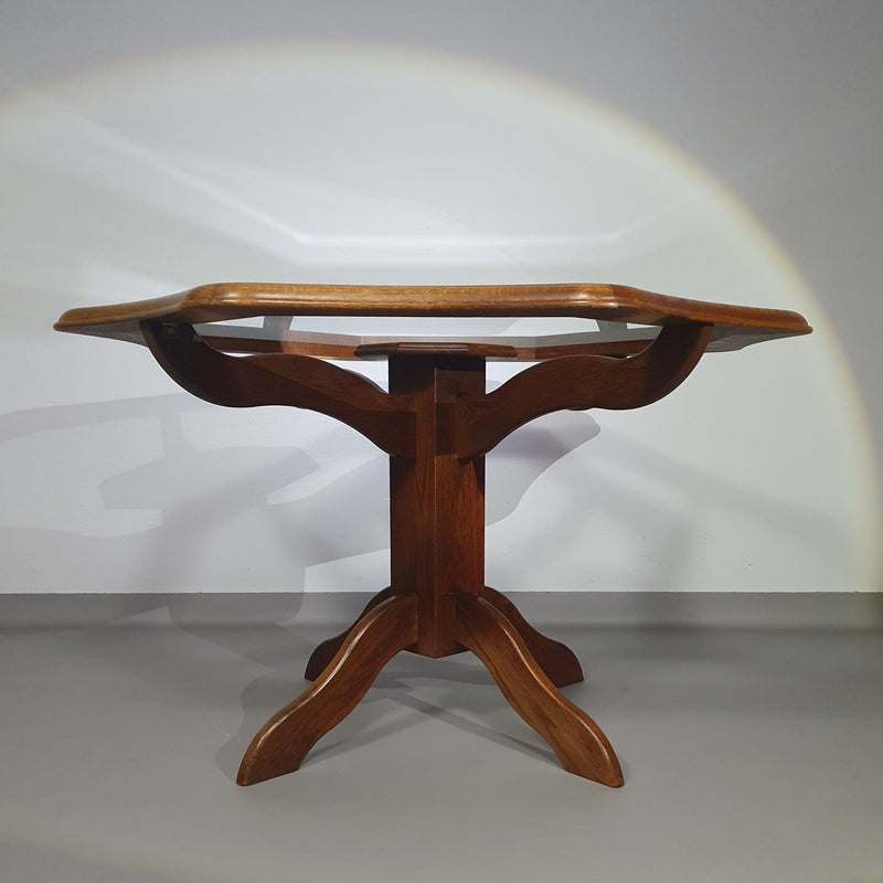 Octagonal oak dining table with inlaid glass top