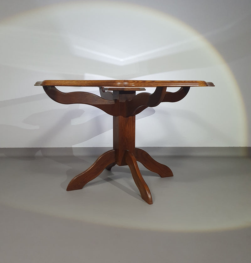 Octagonal oak dining table with inlaid glass top