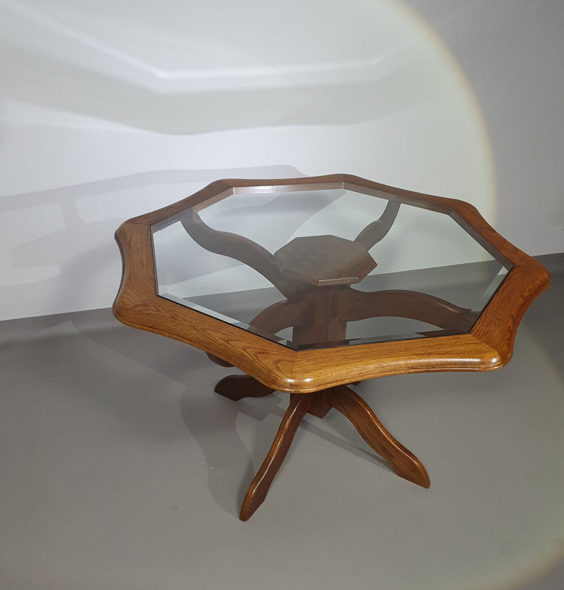 Octagonal oak dining table with inlaid glass top