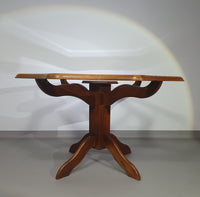 Octagonal oak dining table with inlaid glass top