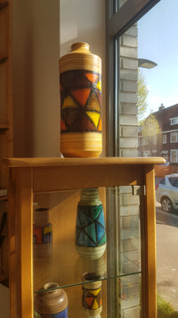 Mid-century pattern Vetrata vases and bowls by Aldo Londi for Bitossi Italy. Black, blue, orange and yellow on a brushed background.