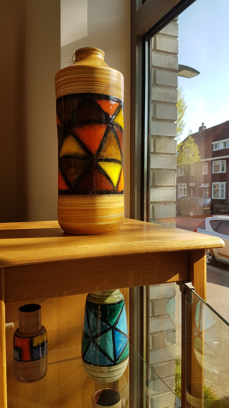 Mid-century pattern Vetrata vases and bowls by Aldo Londi for Bitossi Italy. Black, blue, orange and yellow on a brushed background.